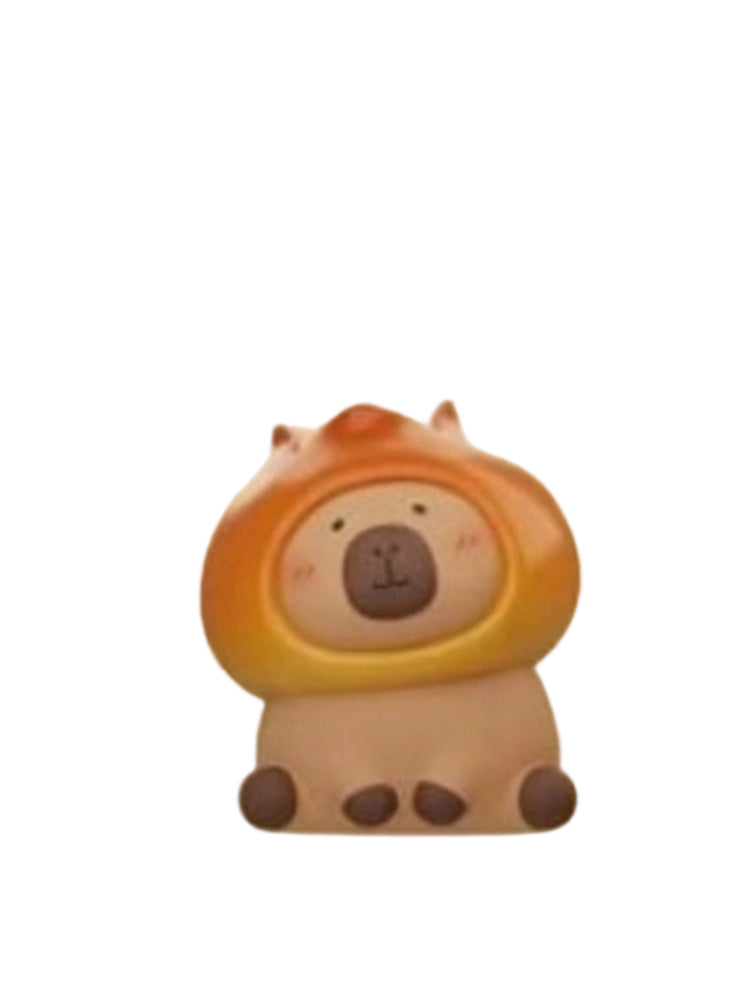 Alkaline Ball capybara mini figure wearing an orange pretzel bread hood, from the Tuntunzai Bakery V2 series