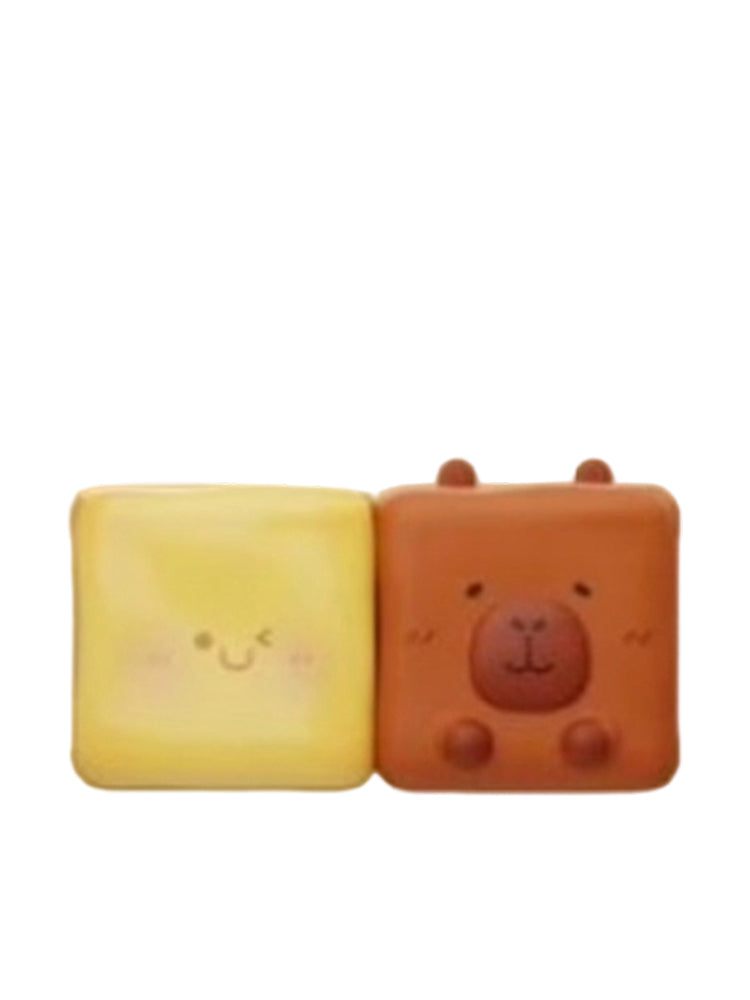 Cheese & Butter capybara mini figure as a brown butter cube next to a cheese cube, from the Tuntunzai Bakery V2 series