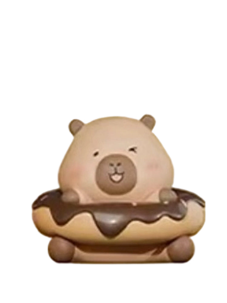 Chocolates capybara mini figure sitting in a chocolate-glazed donut, from the Tuntunzai Bakery series