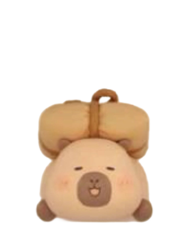 Medicine Bag capybara mini figure carrying a tied herbal medicine bag on its head, from the Tuntunzai Wellness series