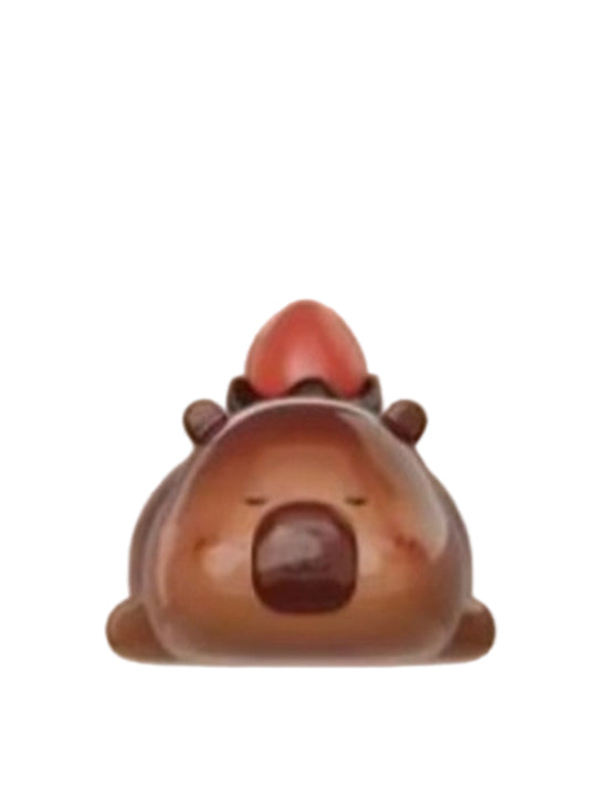 Berry Chocolate capybara mini figure shaped like a chocolate bonbon with a strawberry on top, from the Tuntunzai Capybara Chocolate series