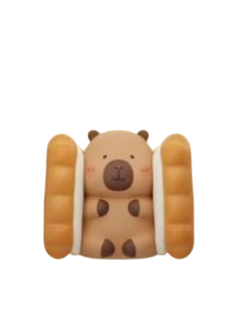 Biscuit capybara mini figure sandwiched between two biscuit sticks, from the Tuntunzai Bakery V2 series
