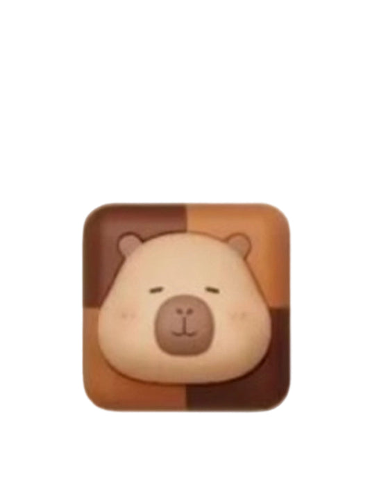 Choco Square capybara mini figure on a checkered square of milk and dark chocolate, from the Tuntunzai Capybara Chocolate series