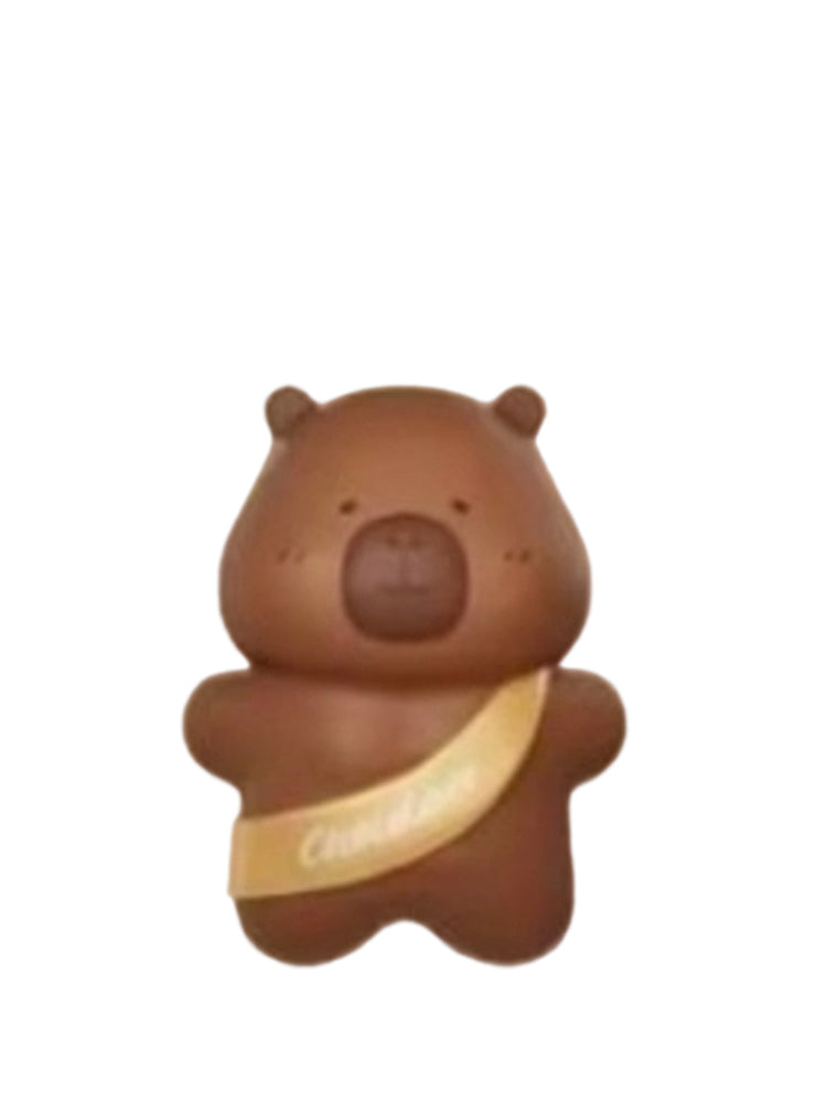 Chocolate Bar capybara mini figure in chocolate brown with a gold chocolate-bar sash, from the Tuntunzai Capybara Chocolate series