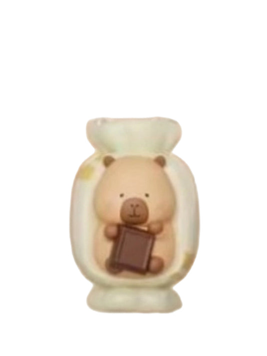 Chocolate Candy capybara mini figure holding a chocolate square inside a twist-wrapped candy, from the Tuntunzai Capybara Chocolate series