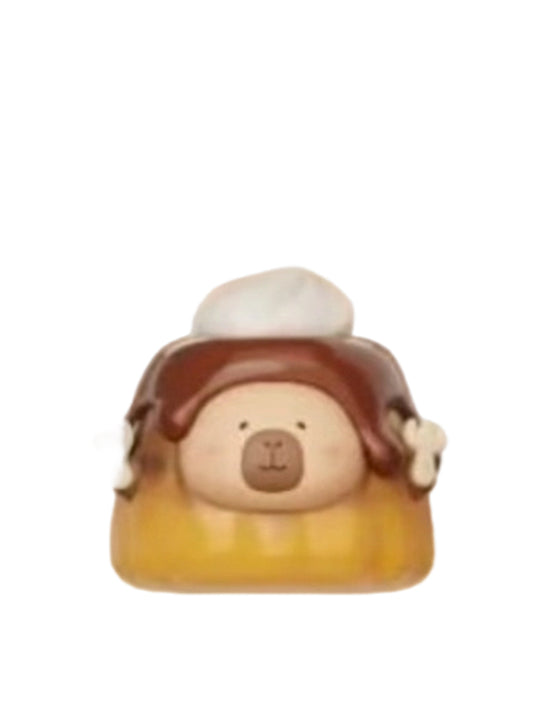 Chocolate Pudding capybara mini figure in a caramel pudding with chocolate sauce and whipped cream, from the Tuntunzai Capybara Chocolate series