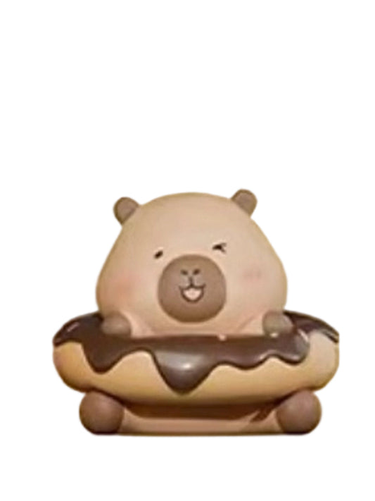Chocolates capybara mini figure sitting in a chocolate-glazed donut, from the Tuntunzai Bakery series