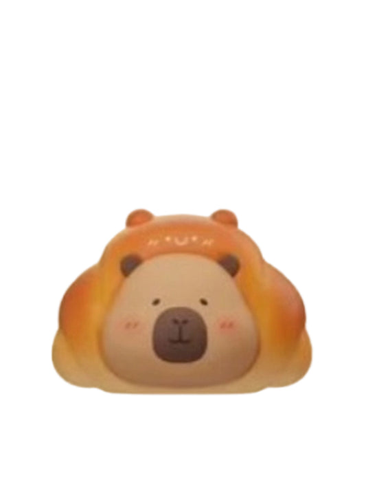 Croissant capybara mini figure wearing a golden croissant hood, from the Tuntunzai Bakery V2 series