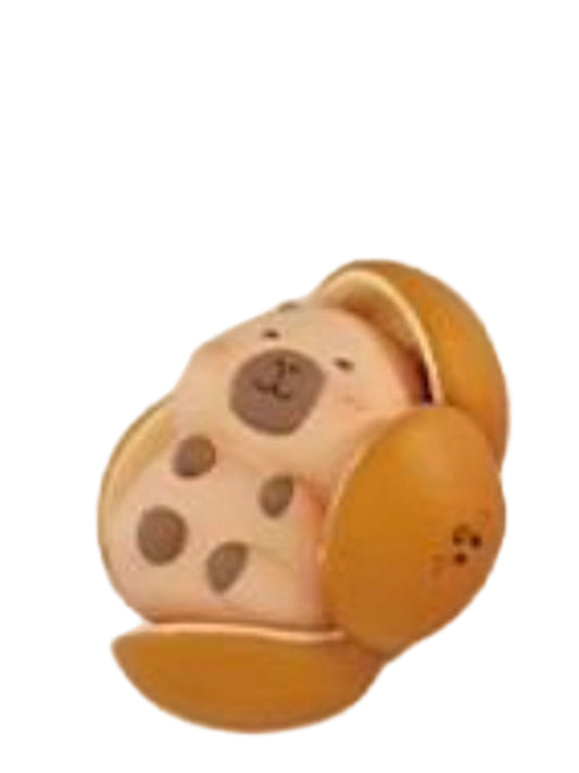 Dried Orange Peel capybara mini figure tucked inside a dried orange peel, from the Tuntunzai Wellness series