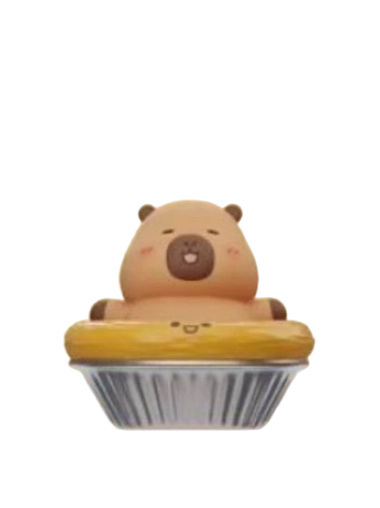 Egg Tarts capybara mini figure sitting in an egg tart in a foil cup, from the Tuntunzai Bakery V2 series