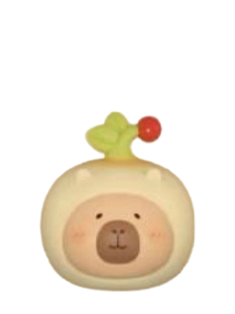 Ginseng Sitting capybara mini figure sitting in a cream ginseng costume with a red berry sprout, from the Tuntunzai Wellness series