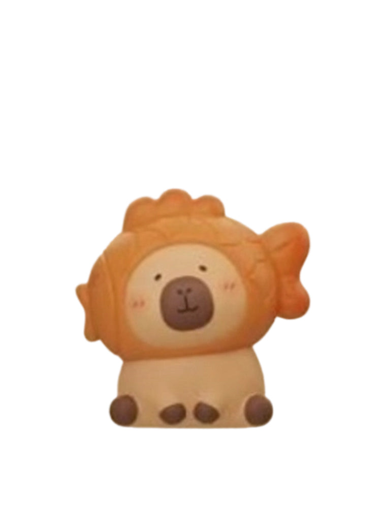 Grilled Sea Bream capybara mini figure wearing a grilled sea bream pastry hood, from the Tuntunzai Bakery V2 series