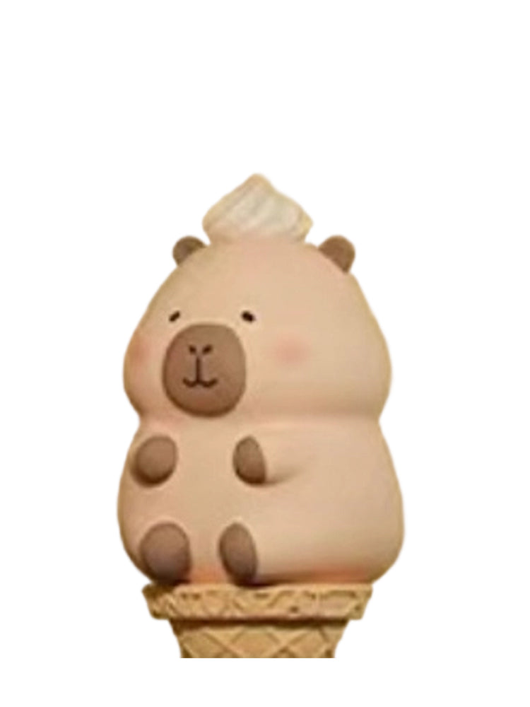 Ice Cream capybara mini figure sitting on a waffle ice cream cone with whipped cream, from the Tuntunzai Bakery series