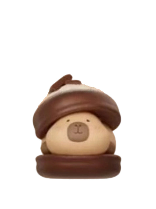 Macaron Chocolate capybara mini figure sandwiched in a chocolate macaron, from the Tuntunzai Capybara Chocolate series