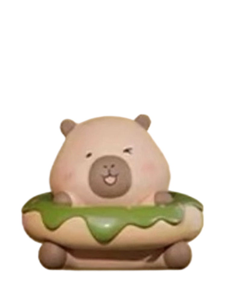 Matcha Donuts Special capybara mini figure sitting in a green matcha-glazed donut, from the Tuntunzai Bakery series
