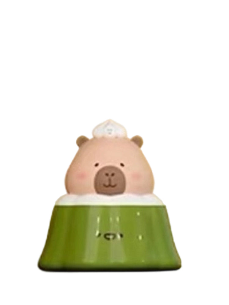 Matcha Pudding Special capybara mini figure sitting in a green matcha pudding with a chef hat, from the Tuntunzai Bakery series