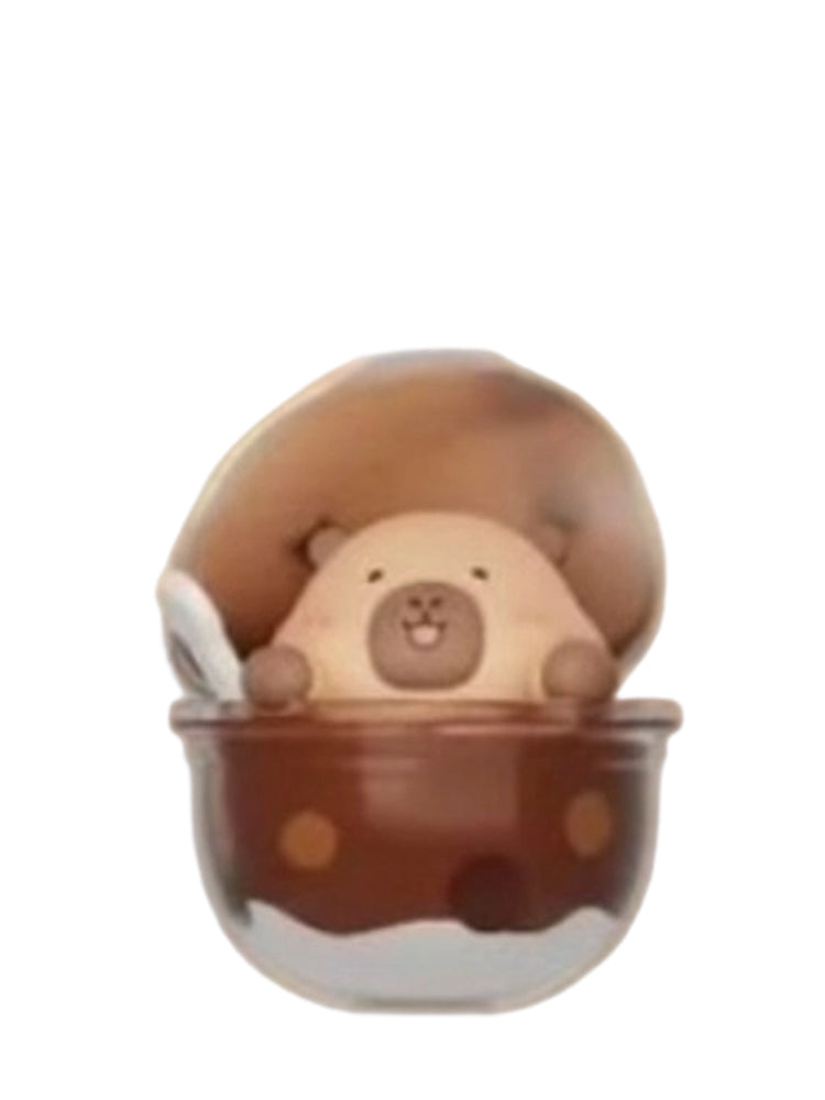Planet Cup capybara mini figure in a clear dessert cup under a chocolate dome, from the Tuntunzai Capybara Chocolate series