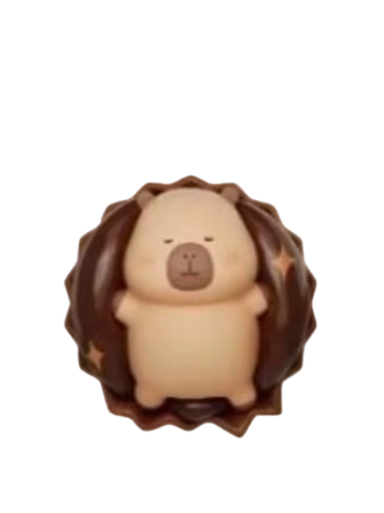 Rich Chocolate capybara mini figure inside a ruffled round chocolate, from the Tuntunzai Capybara Chocolate series