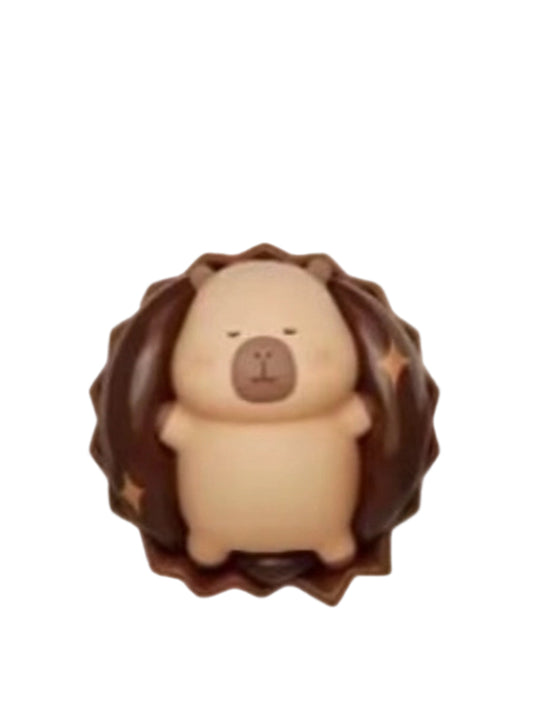 Rich Chocolate capybara mini figure inside a ruffled round chocolate, from the Tuntunzai Capybara Chocolate series