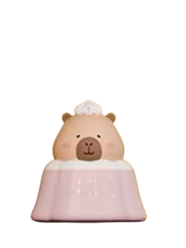 Sakura Pudding Special capybara mini figure sitting in a pink sakura pudding with a chef hat, from the Tuntunzai Bakery series