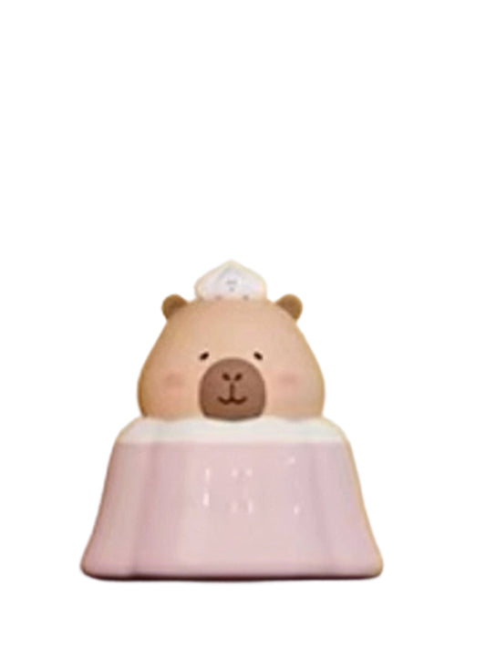 Sakura Pudding Special capybara mini figure sitting in a pink sakura pudding with a chef hat, from the Tuntunzai Bakery series