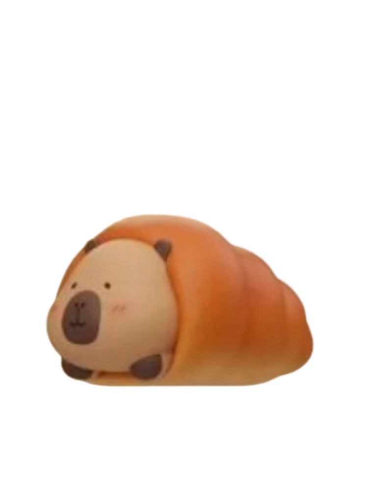 Salt Bread capybara mini figure wrapped in a golden salt bread roll, from the Tuntunzai Bakery V2 series