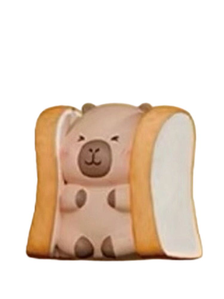 Sandwich Toast capybara mini figure tucked between two slices of toast, from the Tuntunzai Bakery series
