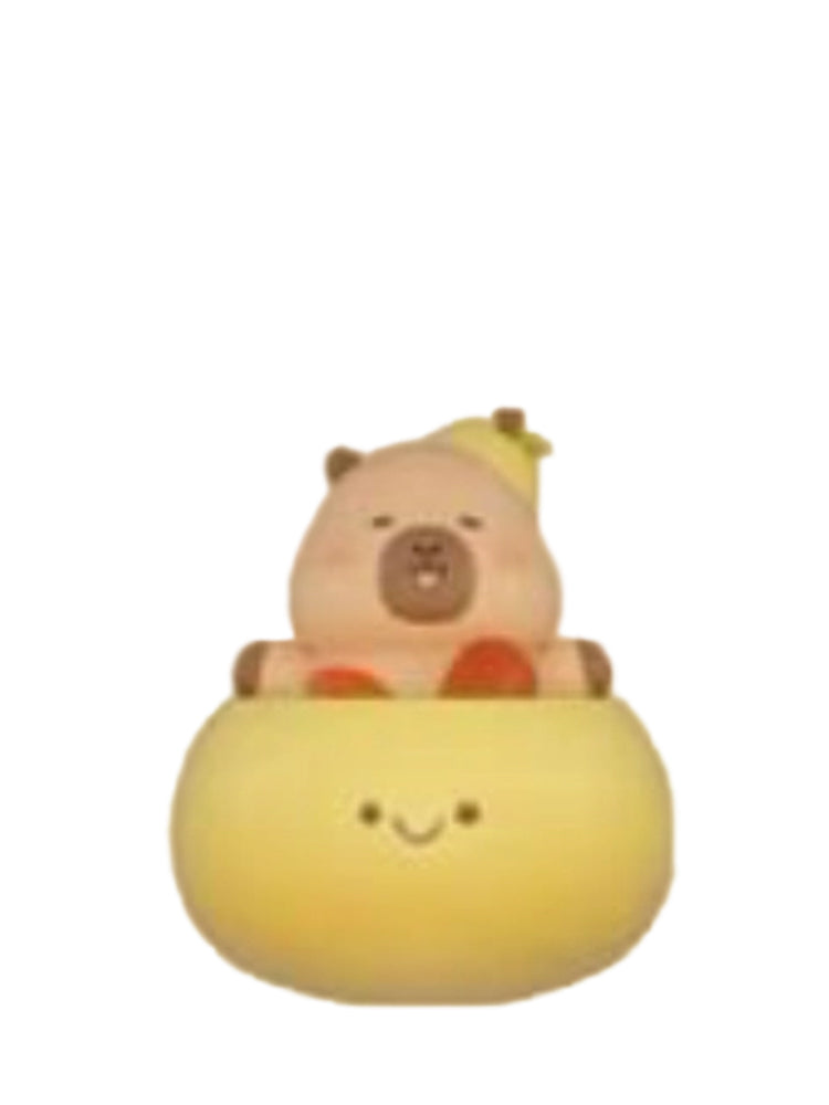 Soup capybara mini figure sitting in a yellow soup bowl, from the Tuntunzai Wellness series