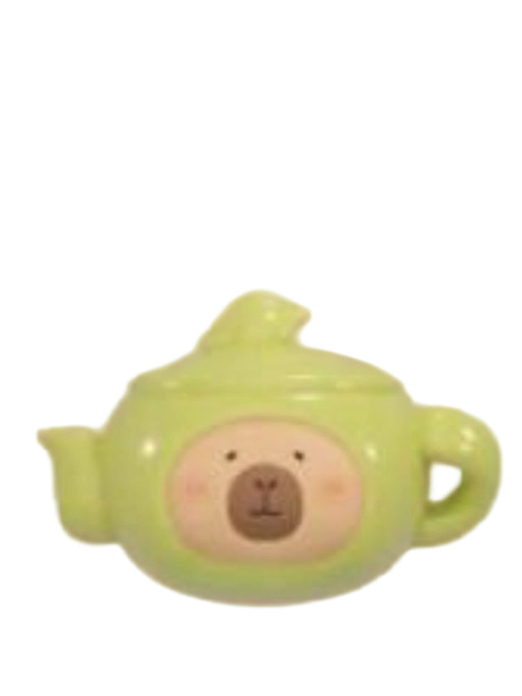 Teapot capybara mini figure dressed as a green teapot, from the Tuntunzai Wellness series