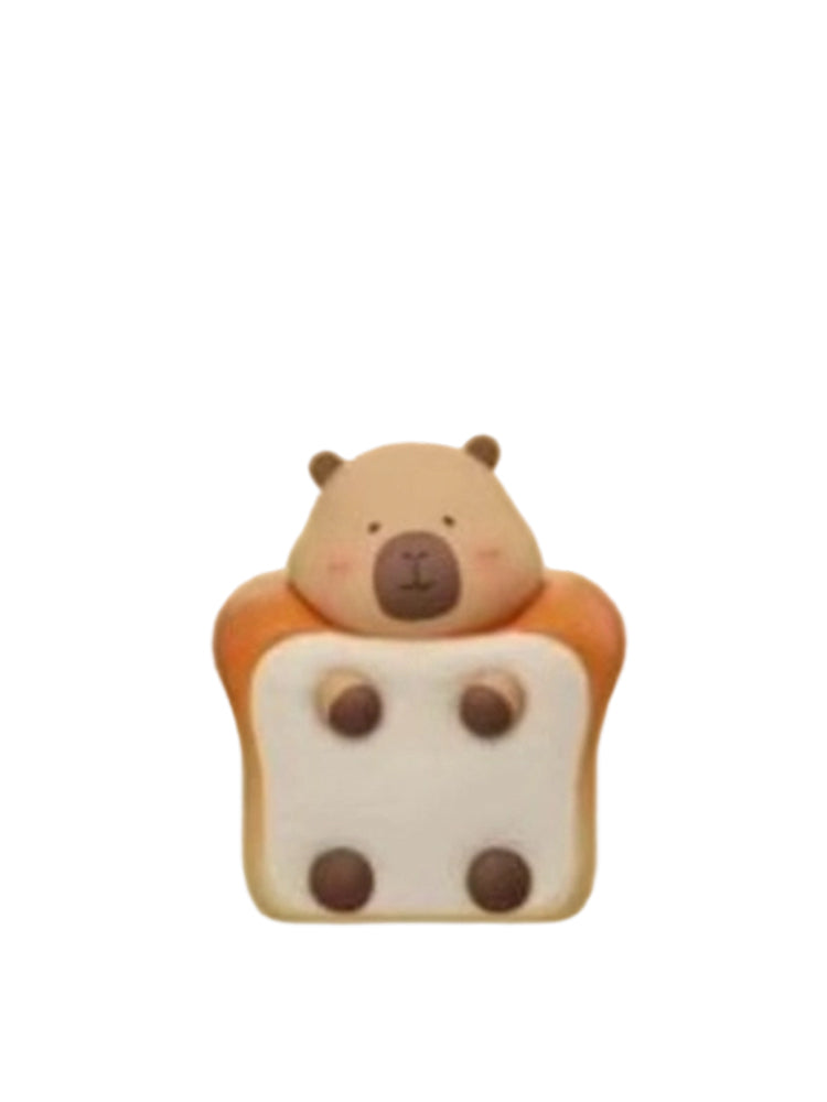 Thick Bun capybara mini figure peeking out of a thick toast bun, from the Tuntunzai Bakery V2 series